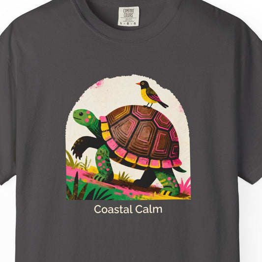 Gray t-shirt with a colorful turtle graphic and 'Coastal Calm' text on a white background