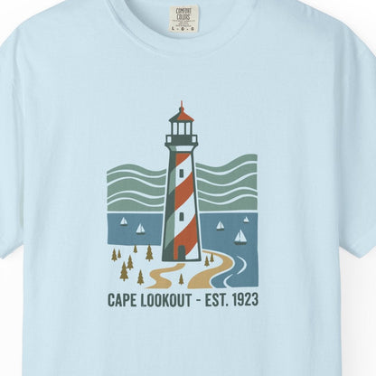 Light blue t-shirt with a lighthouse graphic on a white background
