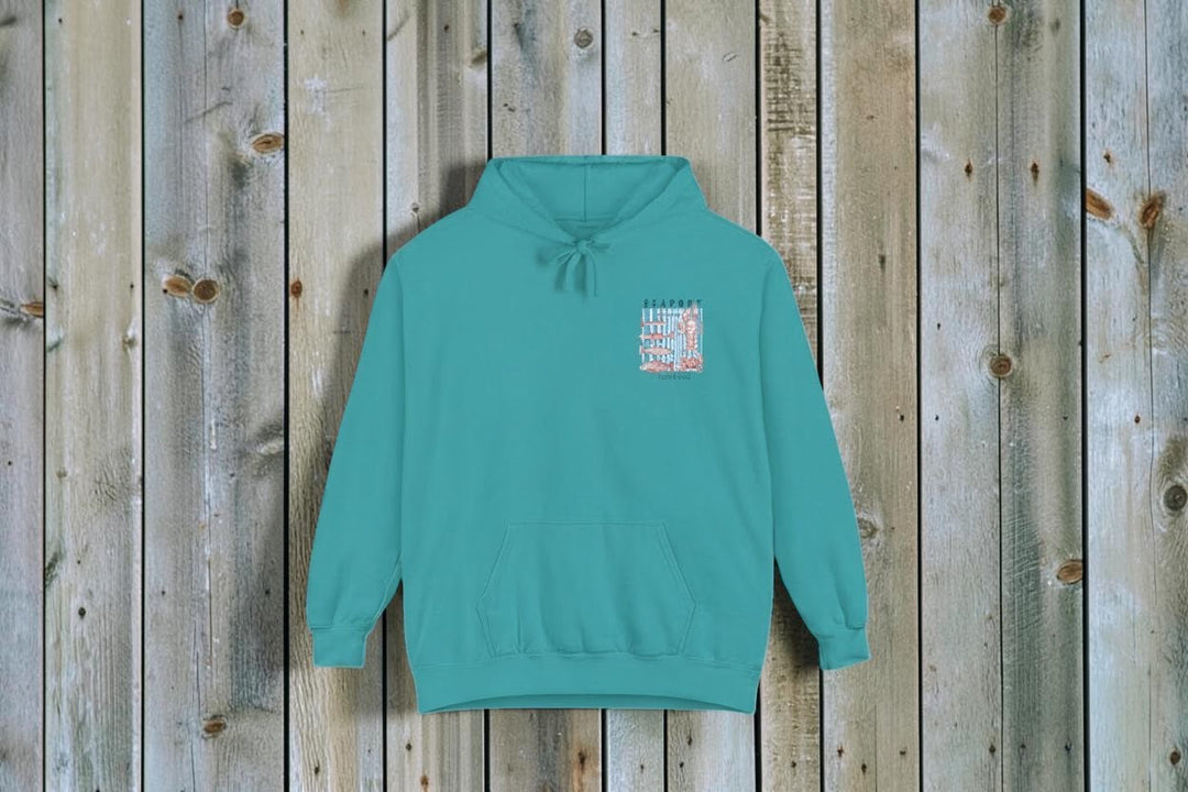 Teal hoodie with a small graphic on the chest against a white background