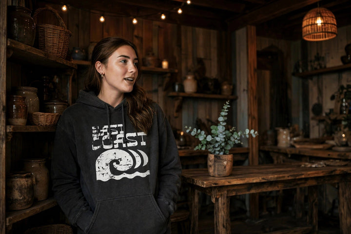 East Coast Hoodie — in the Five Tides room, female front