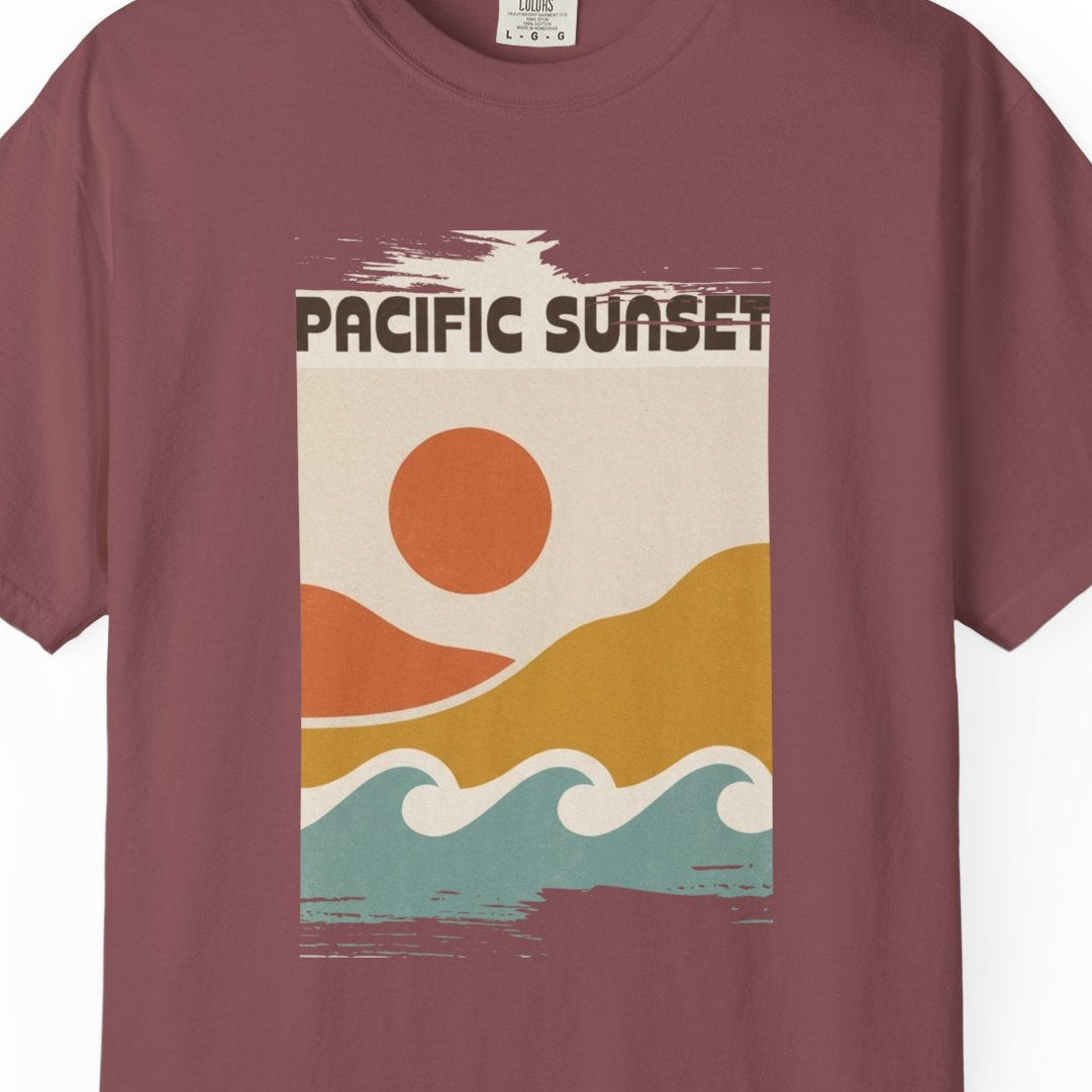 Maroon t-shirt with 'Pacific Sunset' graphic design on a white background