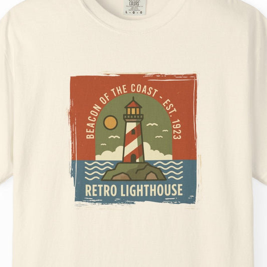 Beige t-shirt with retro lighthouse graphic on a white background