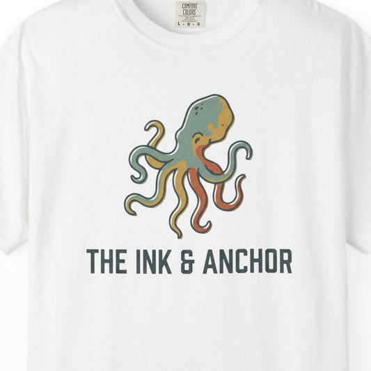 White t-shirt with an octopus graphic and 'The Ink & Anchor' text on a white background