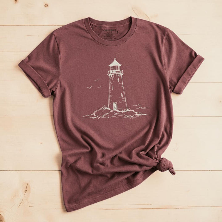 Atlantic Coast Lighthouse Sketch brick garment-dyed tee on weathered wood planks
