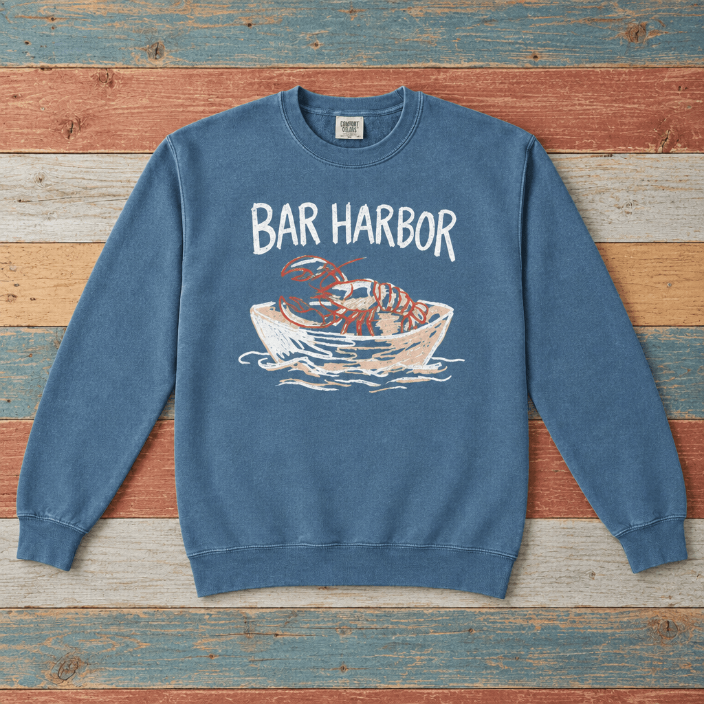 Bar Harbor lobster boat sweatshirt front in Blue Jean on colorful weathered driftwood boards