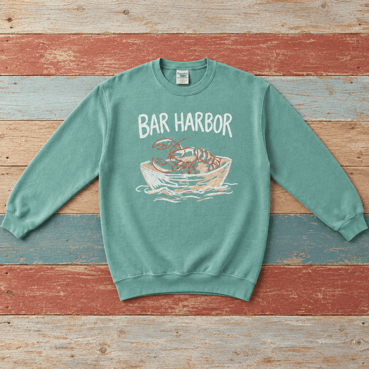 Bar Harbor lobster boat sweatshirt front in Seafoam on colorful weathered driftwood boards