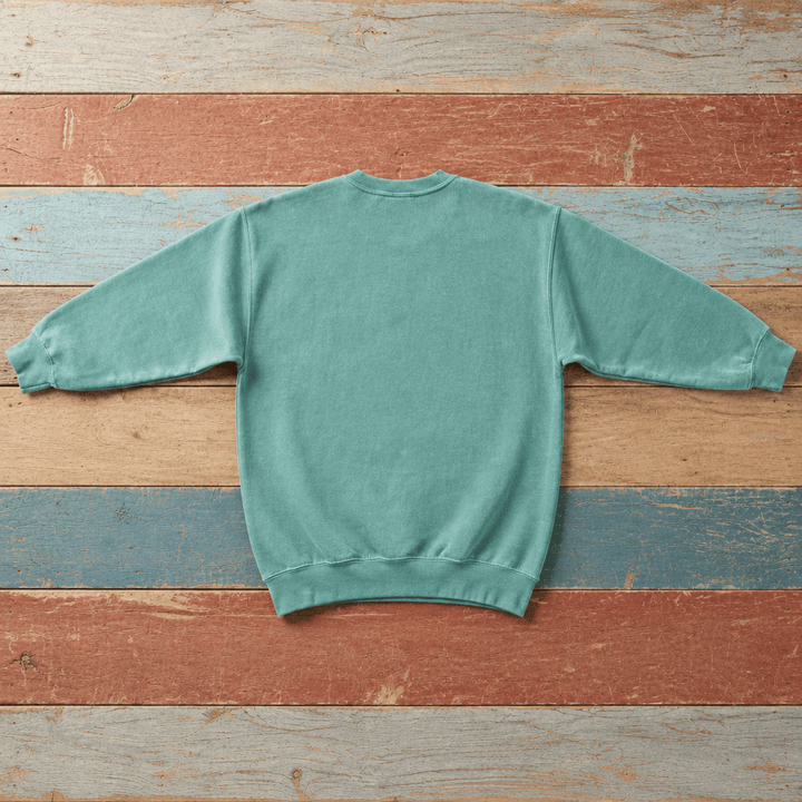 Plain back of Bar Harbor crewneck sweatshirt in Seafoam on colorful weathered driftwood boards