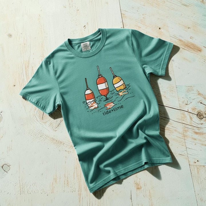 Tide + Time Beach Buoy seafoam garment-dyed tee casually tousled on rustic reclaimed wood
