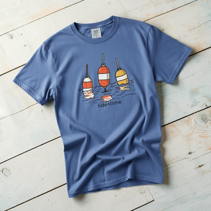 Tide + Time Beach Buoy mystic blue garment-dyed tee casually tousled on rustic reclaimed wood