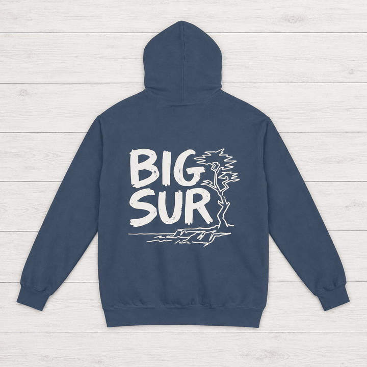 Denim Big Sur hoodie back with white handwritten lettering, coastal trees and cliffs — by Five Tides Apparel