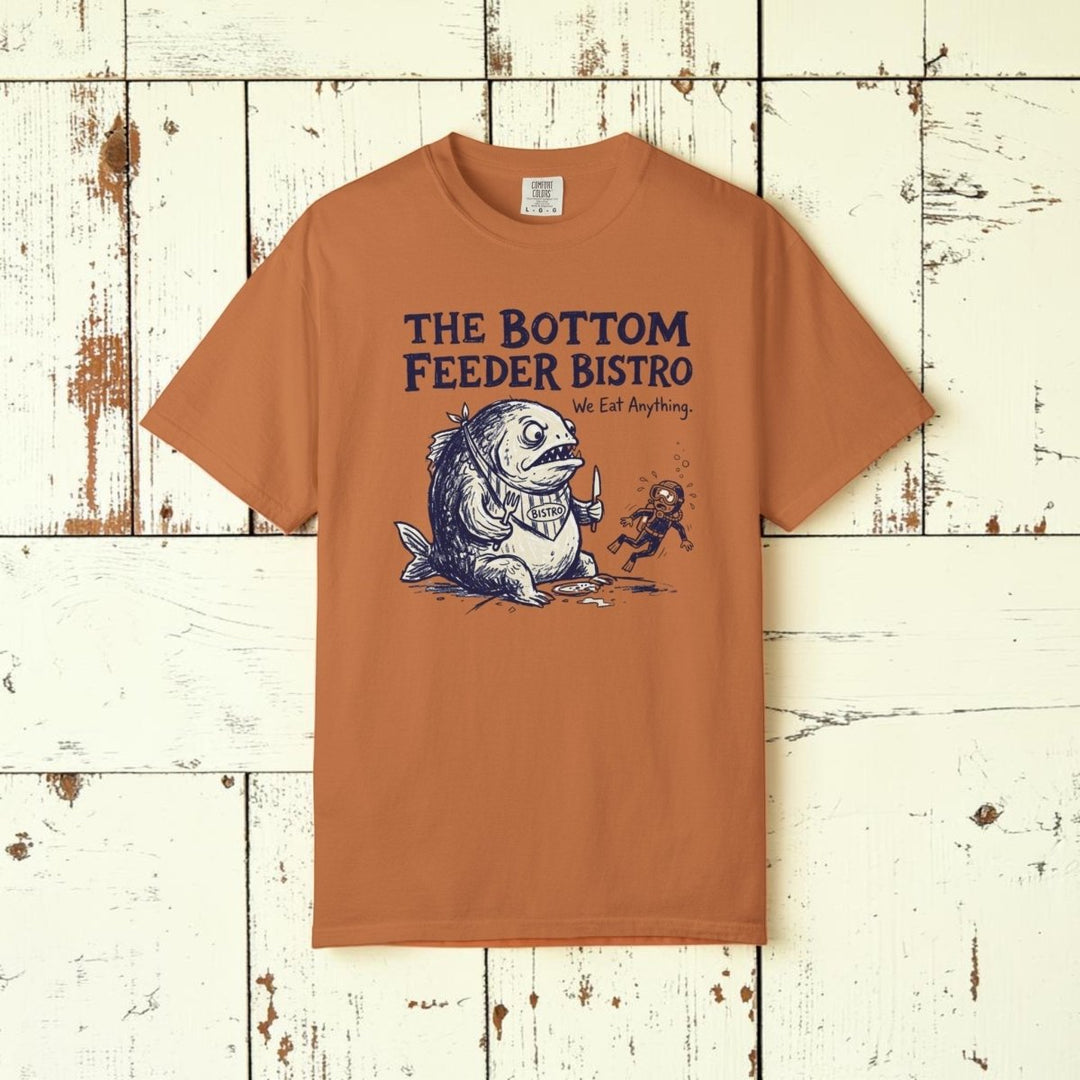 Brown t-shirt with 'The Bottom Feeder Bistro' graphic design on a white background