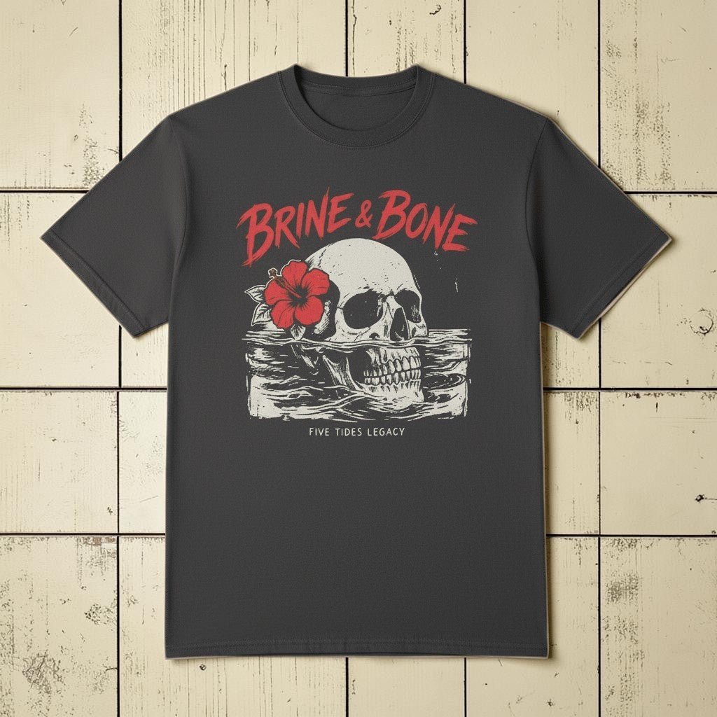 Flat lay - Brine &amp; Bone charcoal tee on weathered driftwood planks