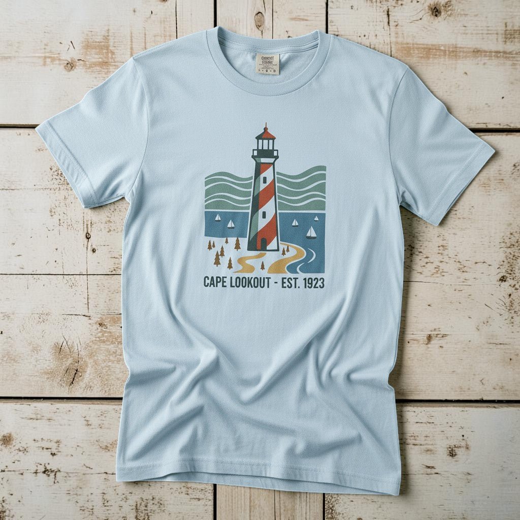Cape Lookout Lighthouse chambray garment-dyed tee on weathered wood planks