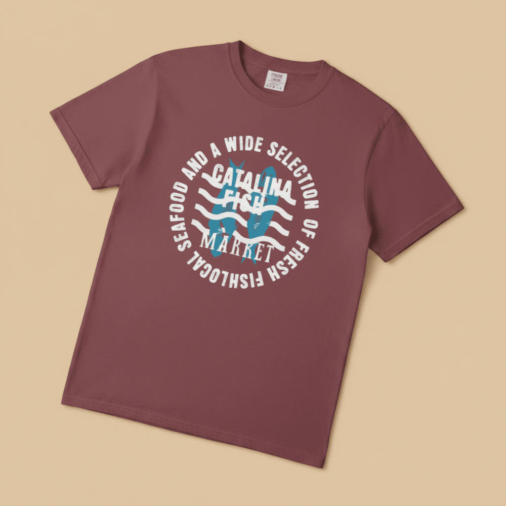 Catalina Fish Market Tee in Mauve/Berry — front graphic, warm sand studio background