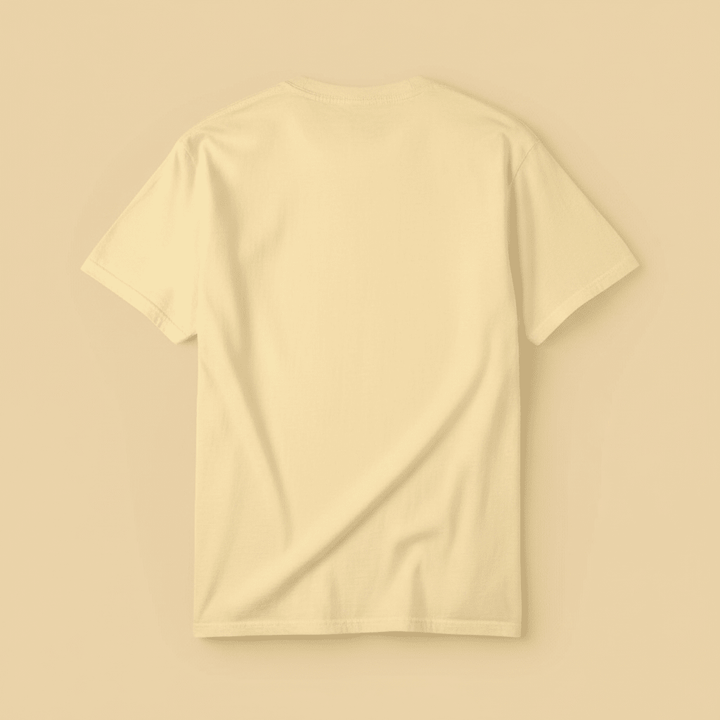 Beach Living Tee in Butter Yellow — plain back, warm sand studio background