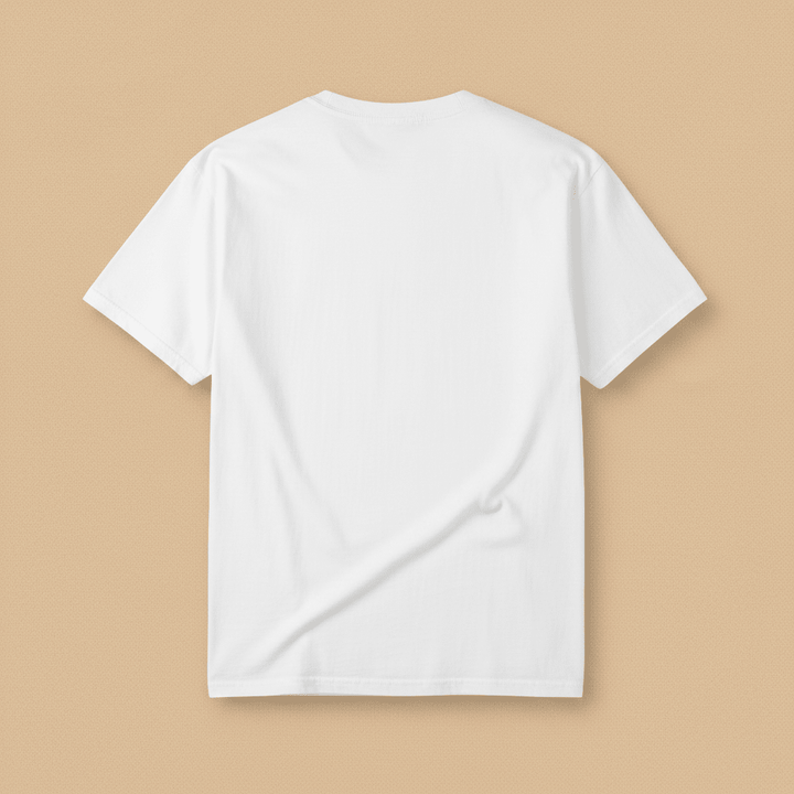 Beach Living Tee in White — plain back, warm sand studio background