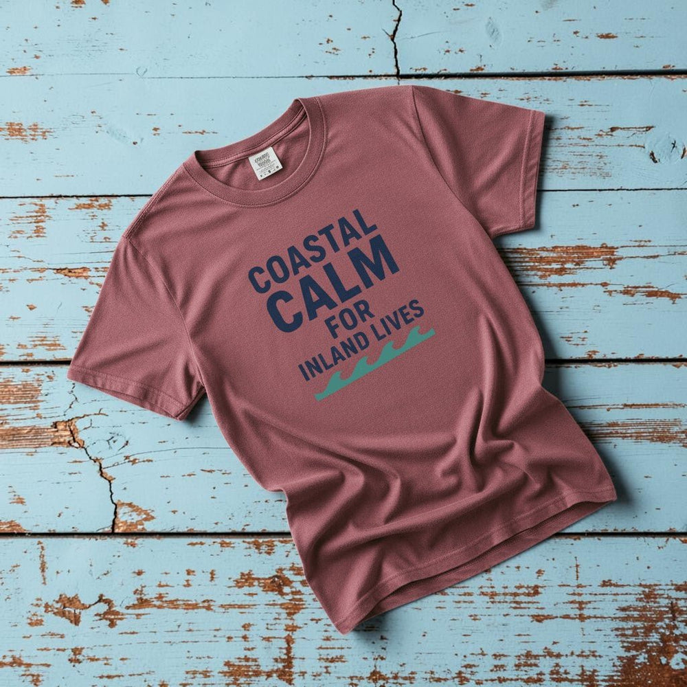 Coastal Calm for Inland Lives II brick garment-dyed tee on faded driftwood planks