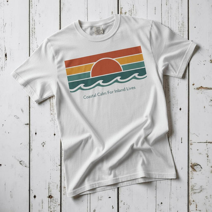 Coastal Calm for Inland Lives white garment-dyed tee on faded driftwood planks