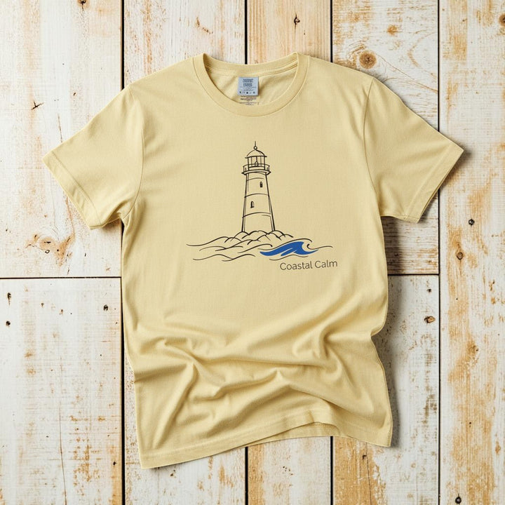 Coastal Calm Lighthouse Blue Sea banana garment-dyed tee on faded driftwood planks