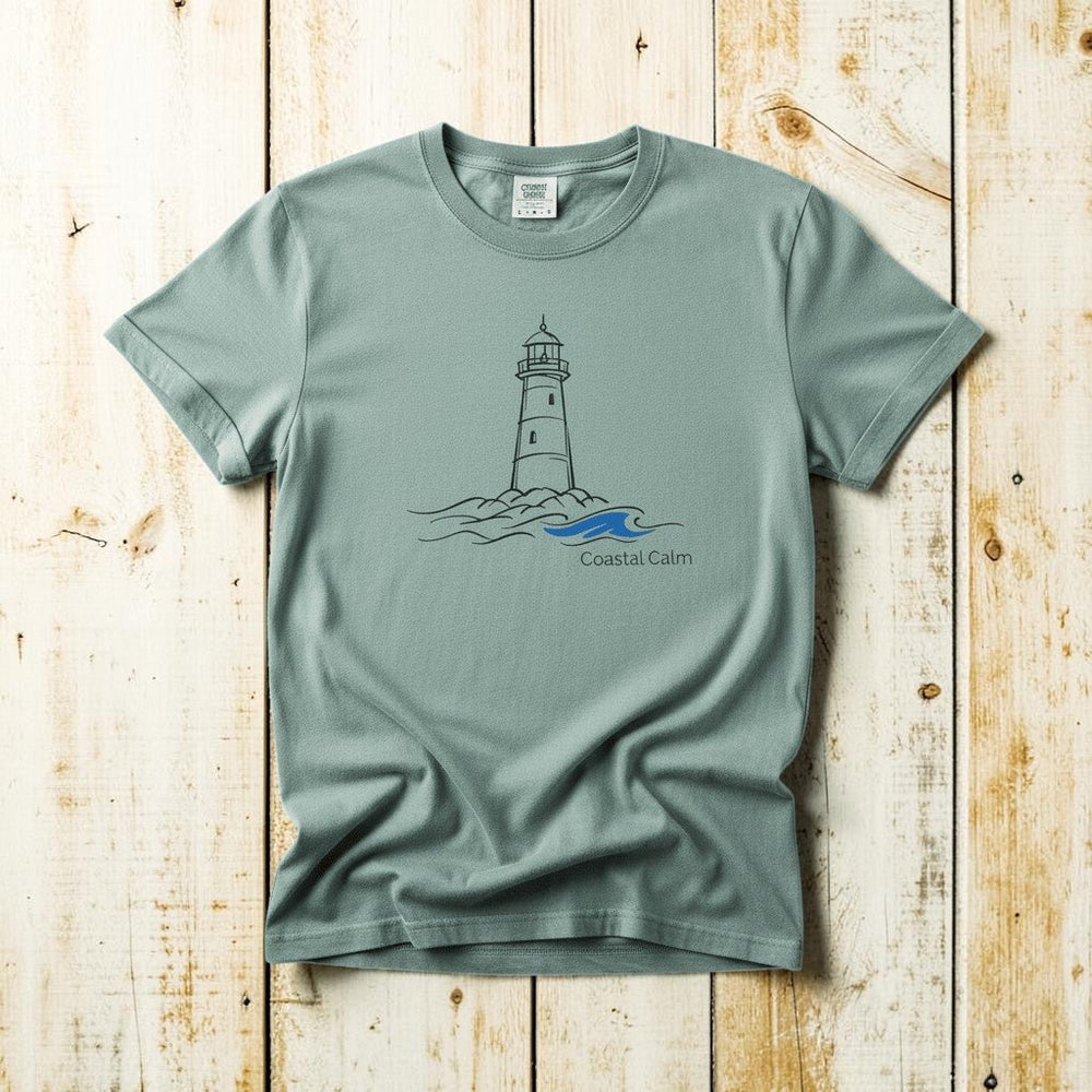Coastal Calm Lighthouse Blue Sea bay garment-dyed tee on faded driftwood planks