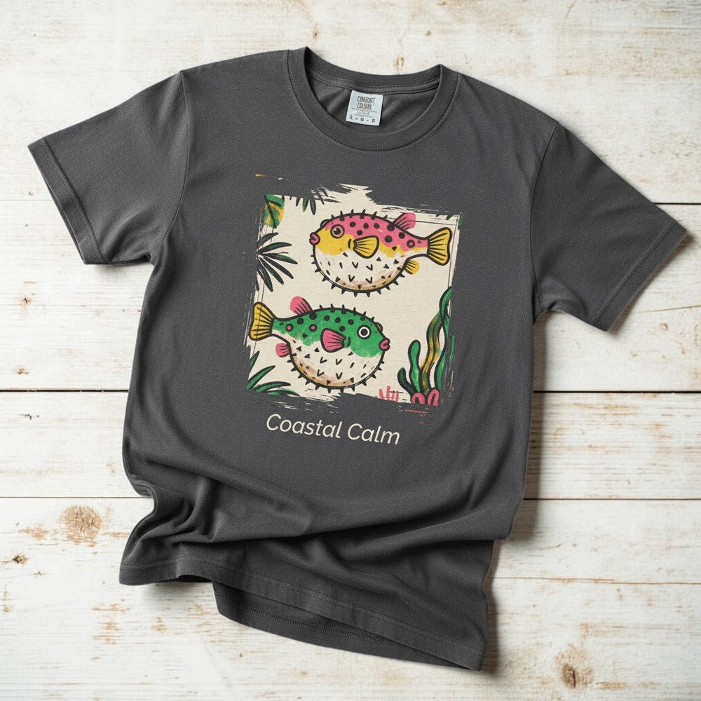 Coastal Calm Pufferfish graphite garment-dyed tee on faded driftwood planks