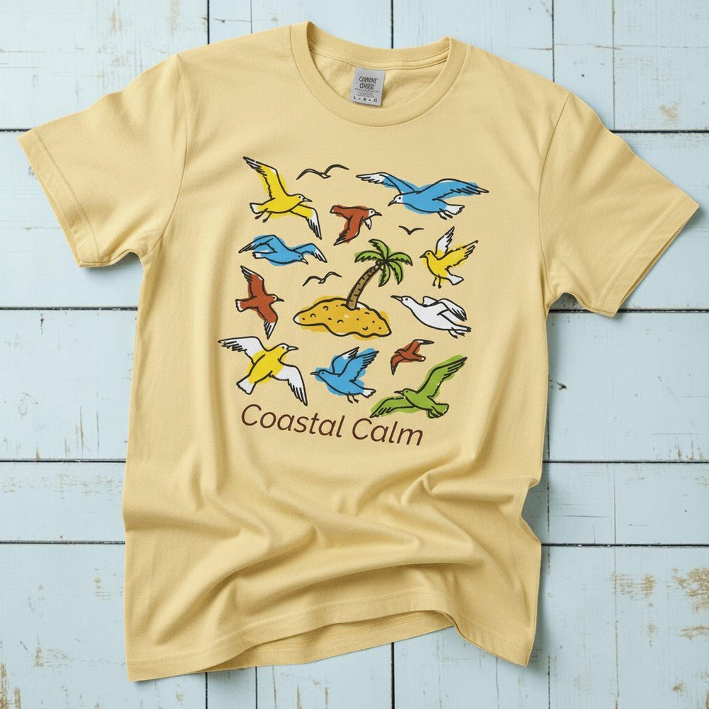 Coastal Calm Sea Birds Take Flight banana garment-dyed tee on faded driftwood planks