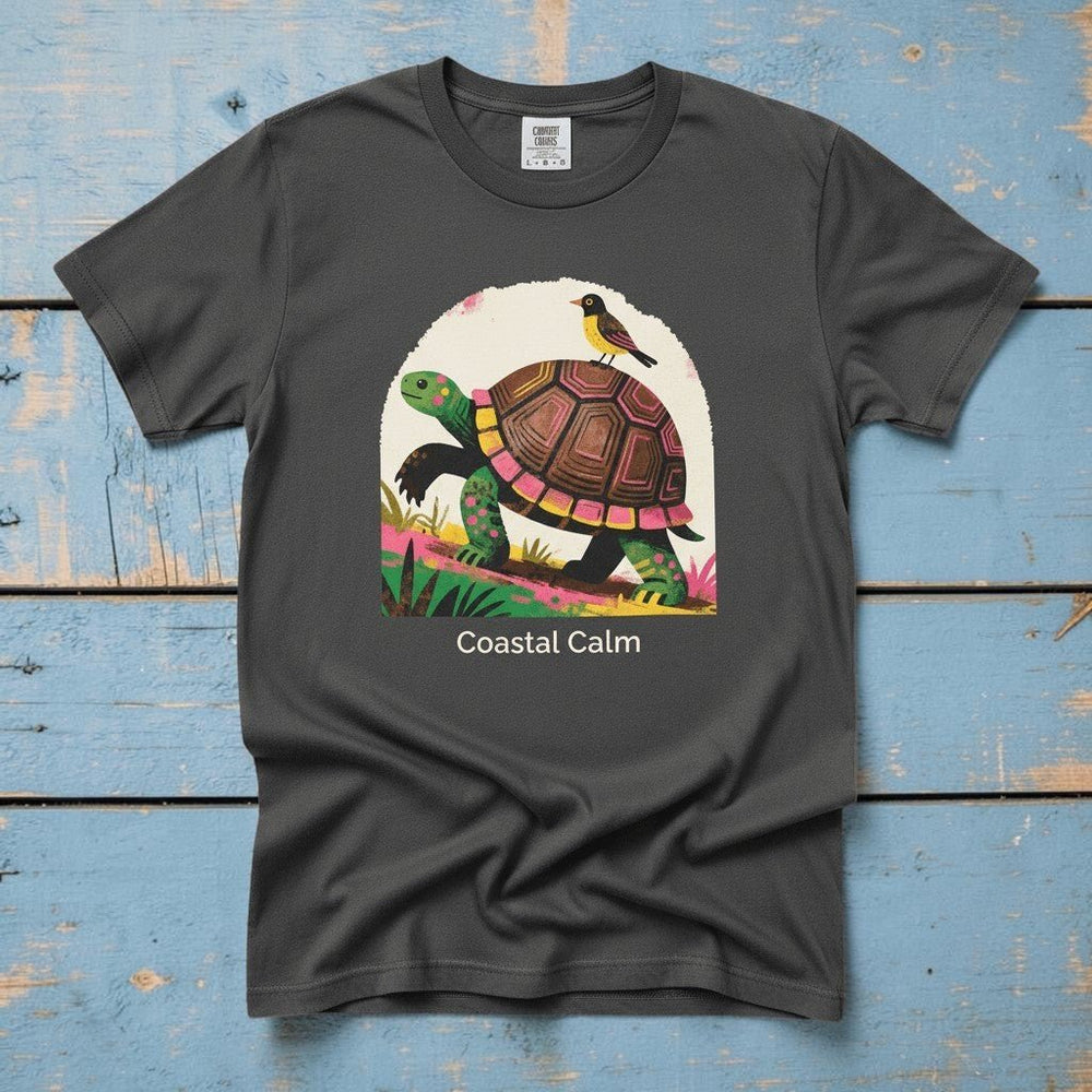 Coastal Calm Turtle Climbing Buddies graphite garment-dyed tee on faded driftwood planks