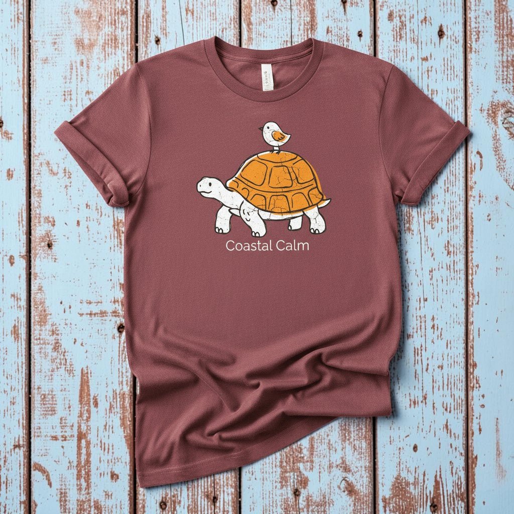 Coastal Calm Turtle Buddies II brick garment-dyed tee on faded driftwood planks