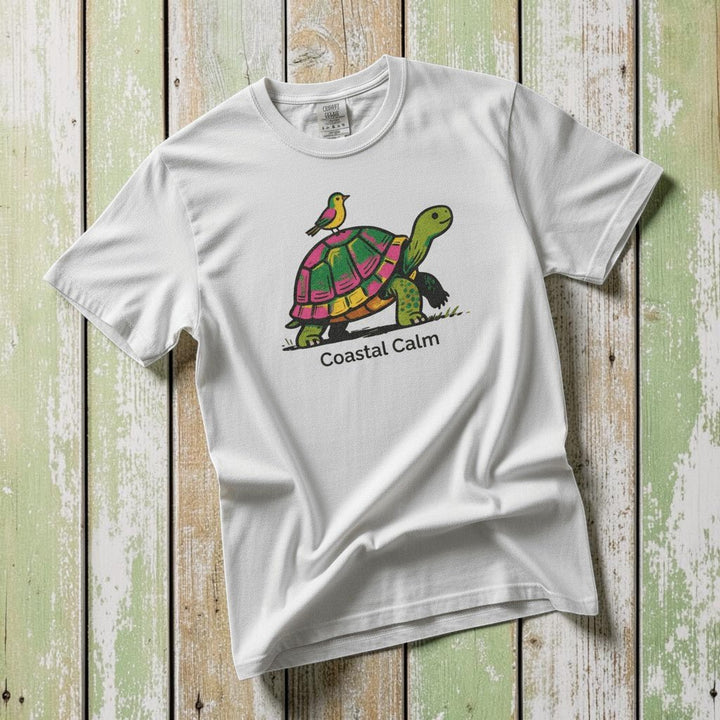 Coastal Calm Turtle Buddies white garment-dyed tee on faded driftwood planks