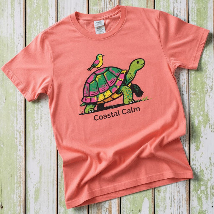 Coastal Calm Turtle Buddies bright salmon garment-dyed tee on faded driftwood planks