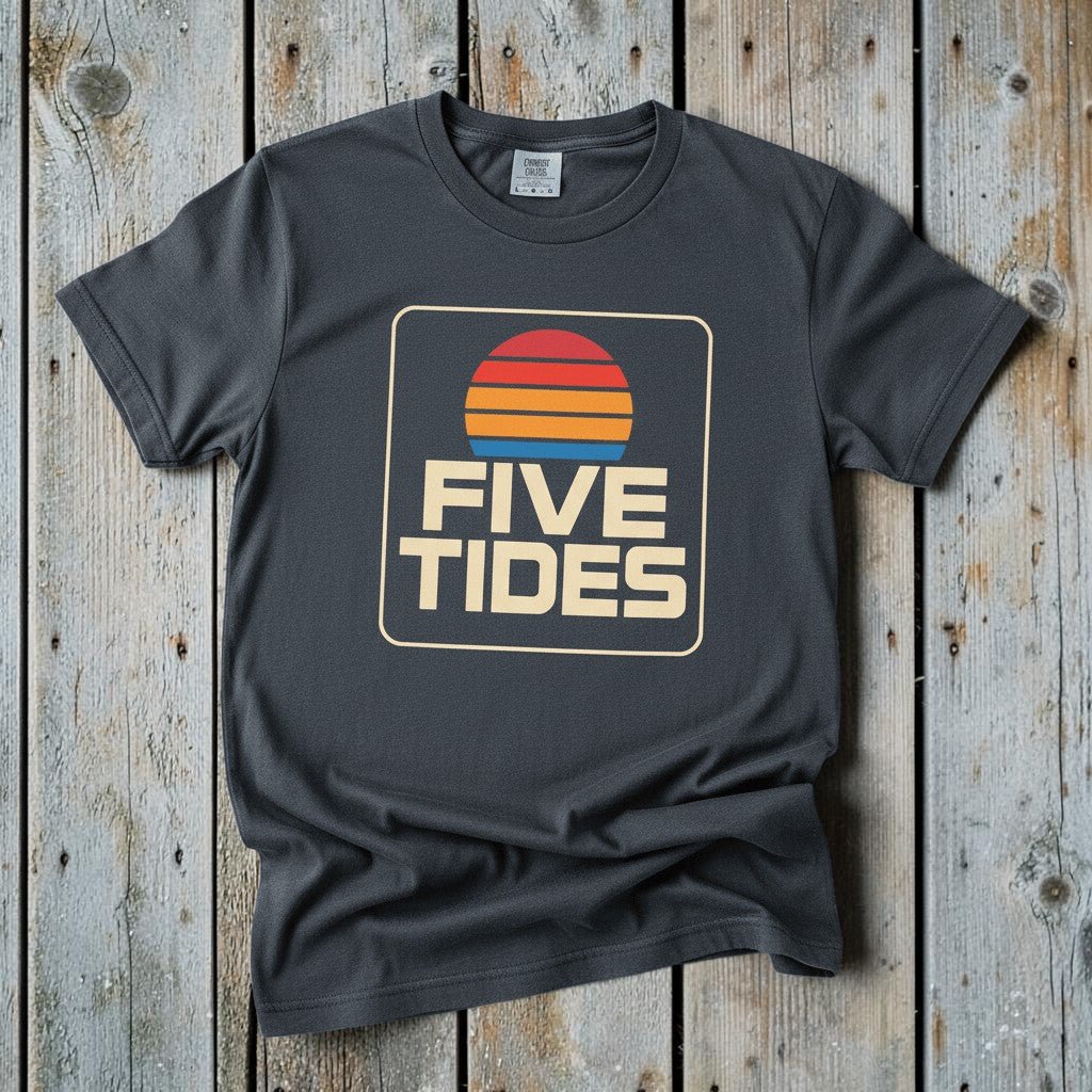 Coastal Retro Sunset graphite garment-dyed tee on faded driftwood planks