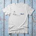 Lighthouse & Whale Coastal Soul white garment-dyed tee on faded driftwood planks