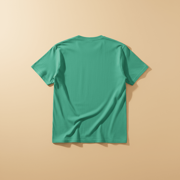 Westcoast Coastal Vibes Tee in Island Green — plain back, warm sand studio background