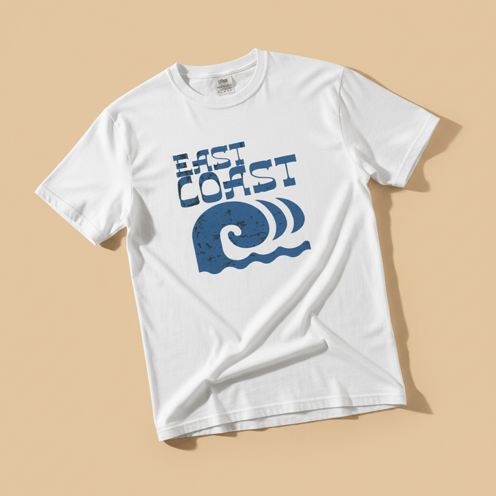 East Coast Wave Tee in White — front graphic, warm sand studio background