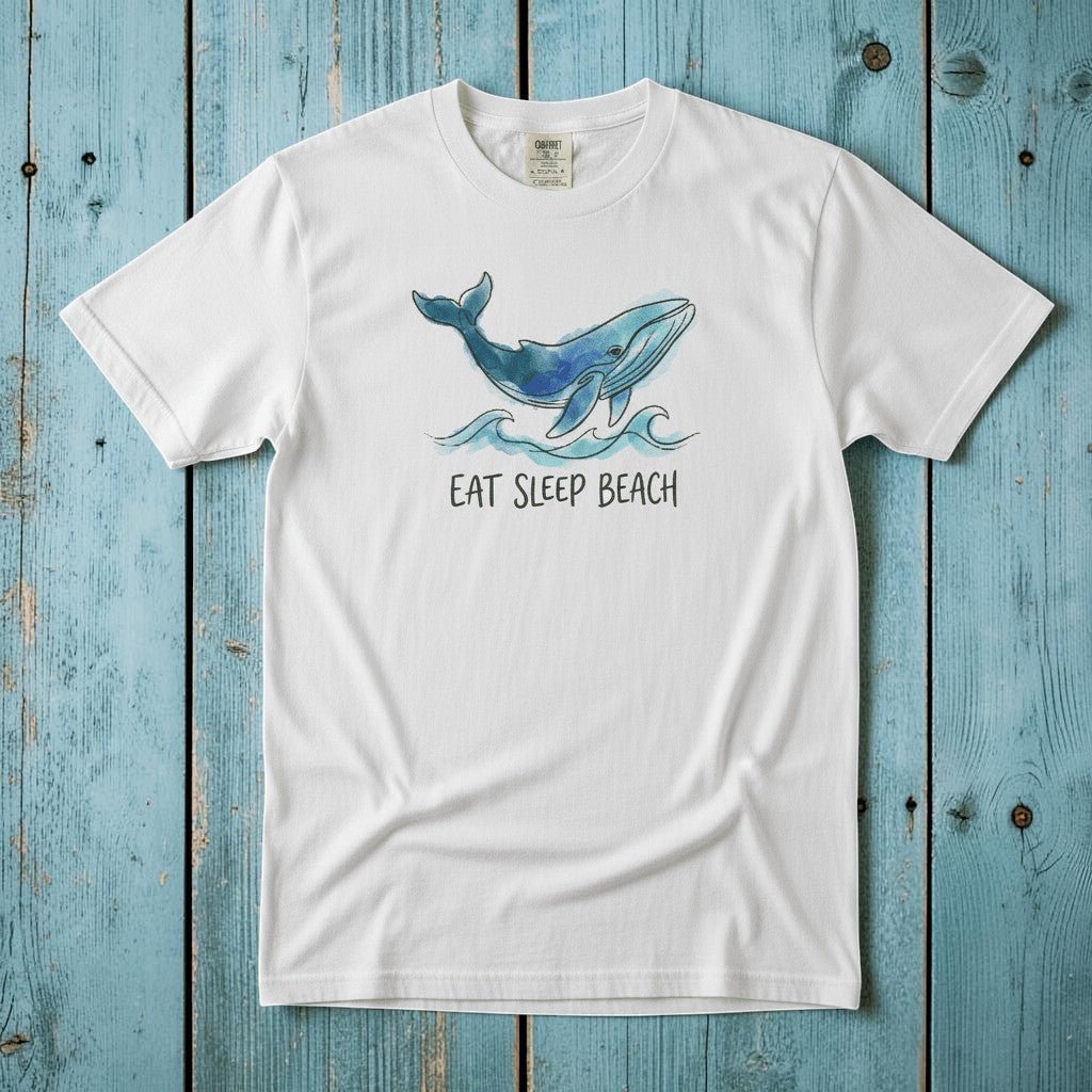 Flat lay - white Eat Sleep Beach tee with Comfort Colors label on weathered driftwood planks