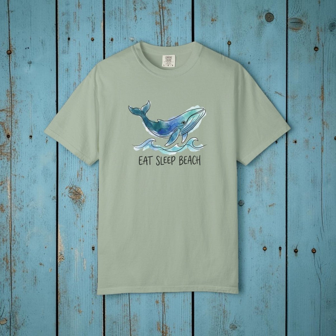 Green t-shirt with a whale graphic and &