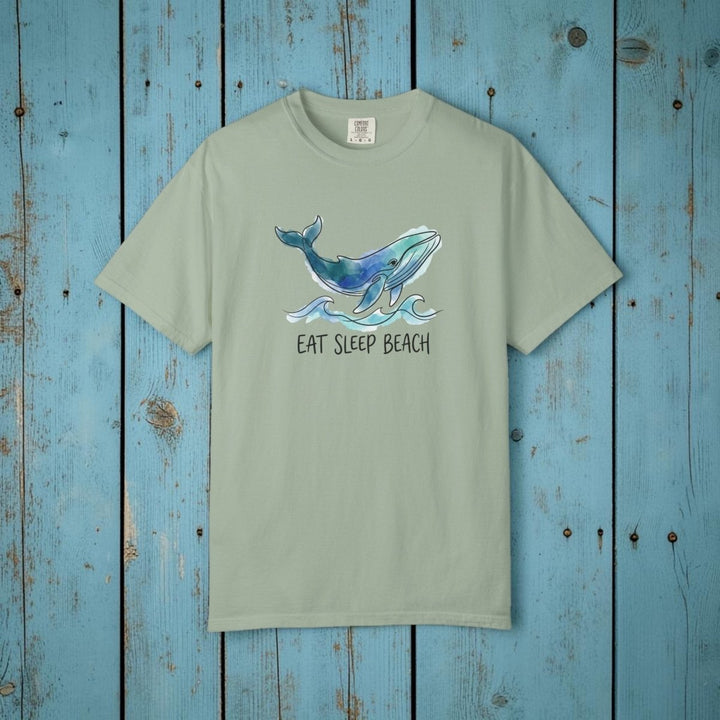 Green t-shirt with a whale graphic and &