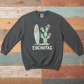 Pepper Encinitas sweatshirt front with surfboard, flowering cactus, and ENCINITAS graphic on driftwood boards