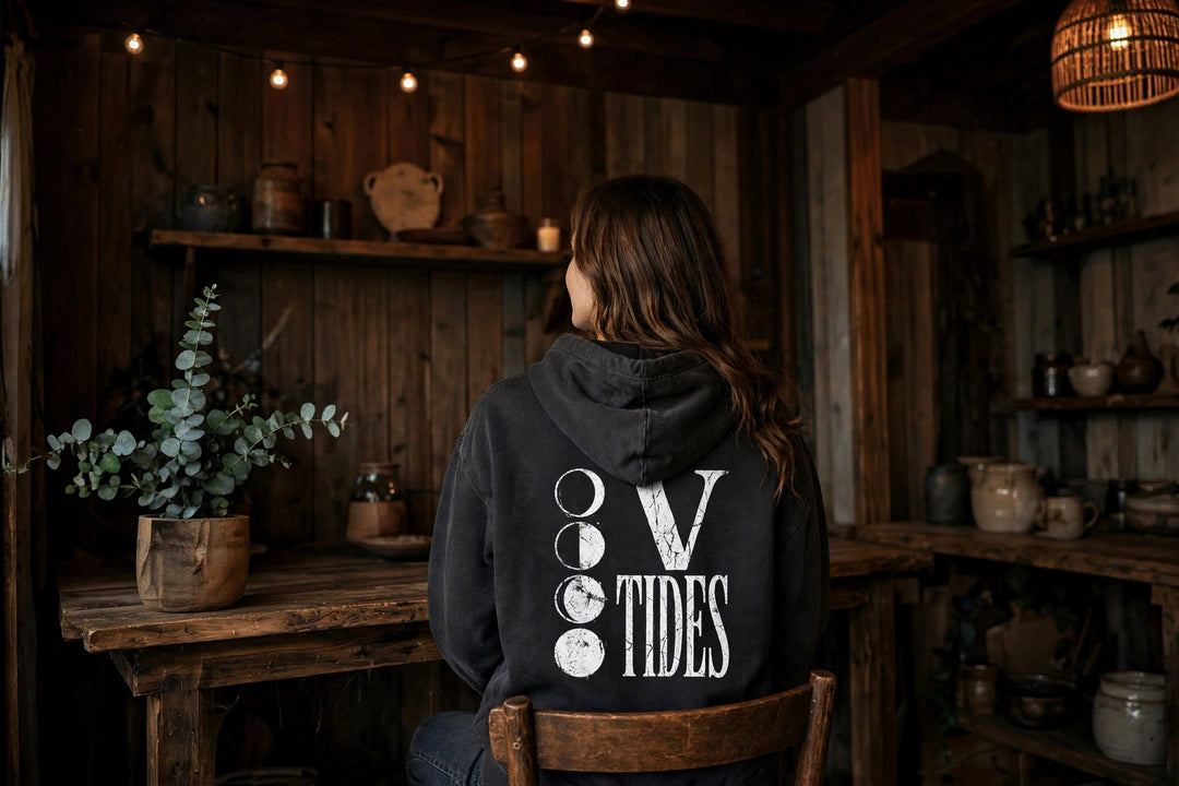 Moon Phases Hoodie — in the Five Tides room, female back