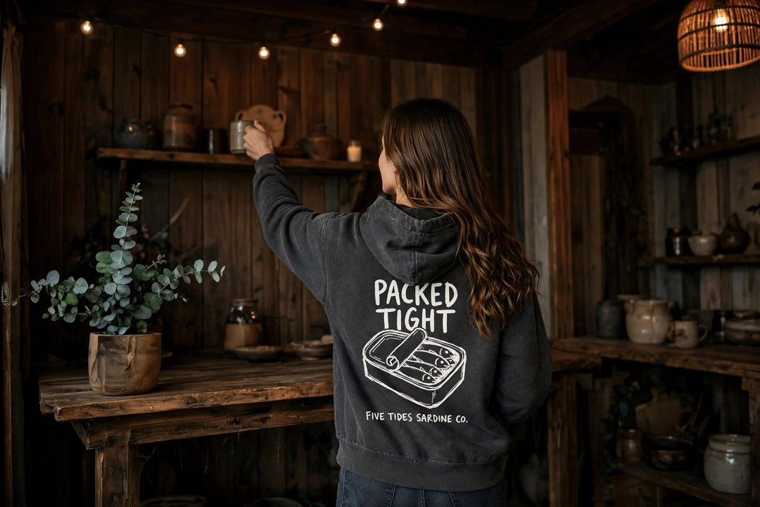 Sardine Co. Logo Hoodie — in the Five Tides room, female back
