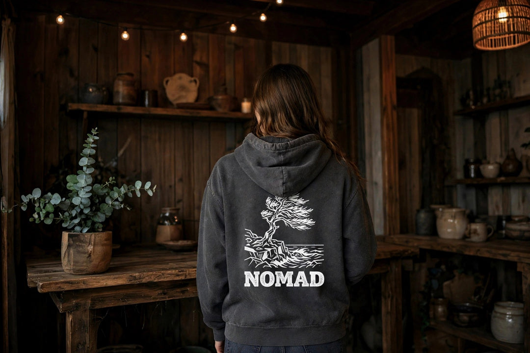 Nomad Windswept Tree Hoodie — in the Five Tides room, female back