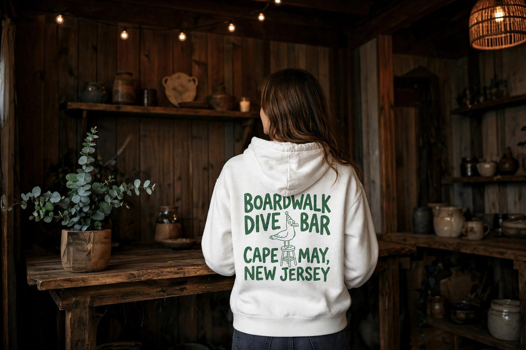Cape May Dive Bar Hoodie — in the Five Tides room, female back