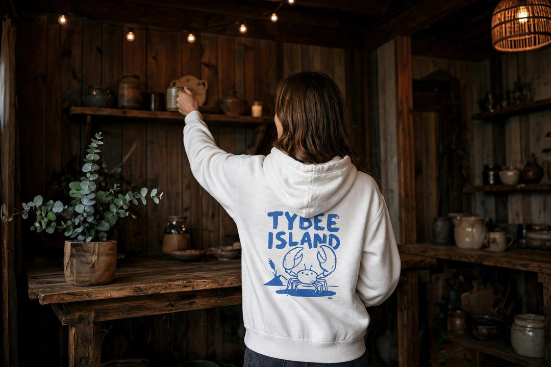 Tybee Island Crab Hoodie — in the Five Tides room, female back