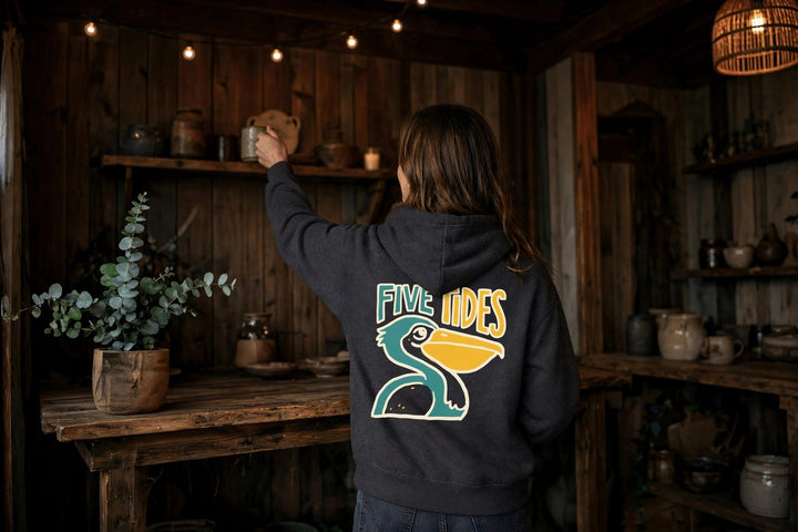 Pelican Coastal Hoodie — in the Five Tides room, female back