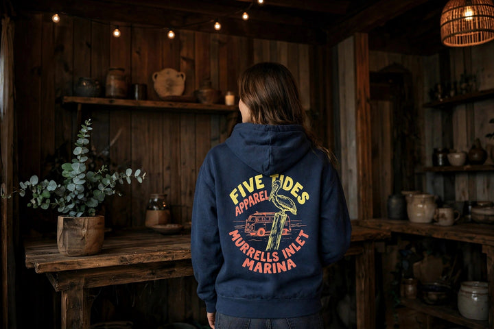 Murrells Inlet Marina Hoodie — in the Five Tides room, female back