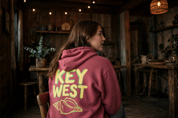 Key West Conch Shell Hoodie — in the Five Tides room, female back