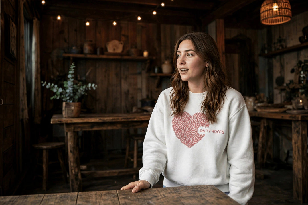 Salty Roots Sweatshirt — in the Five Tides room, female front