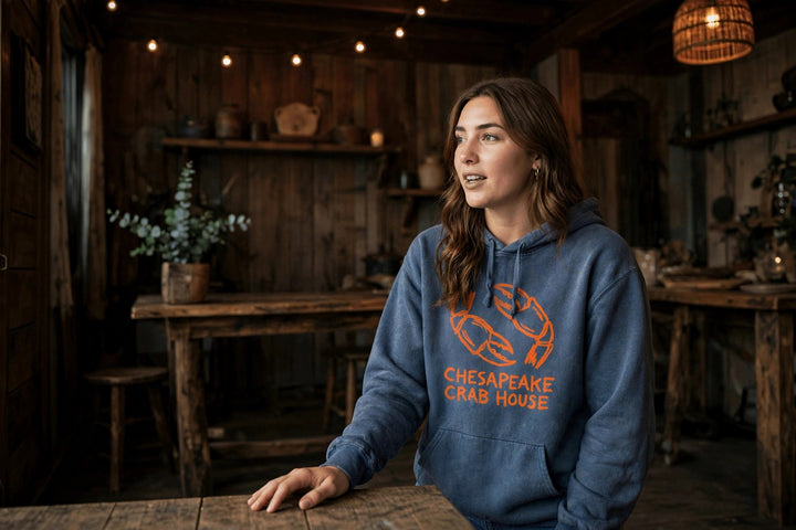Chesapeake Crab House Hoodie — in the Five Tides room, female front