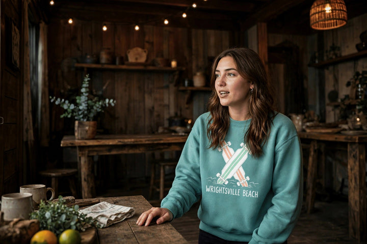 Wrightsville Beach Sweatshirt — in the Five Tides room, female front