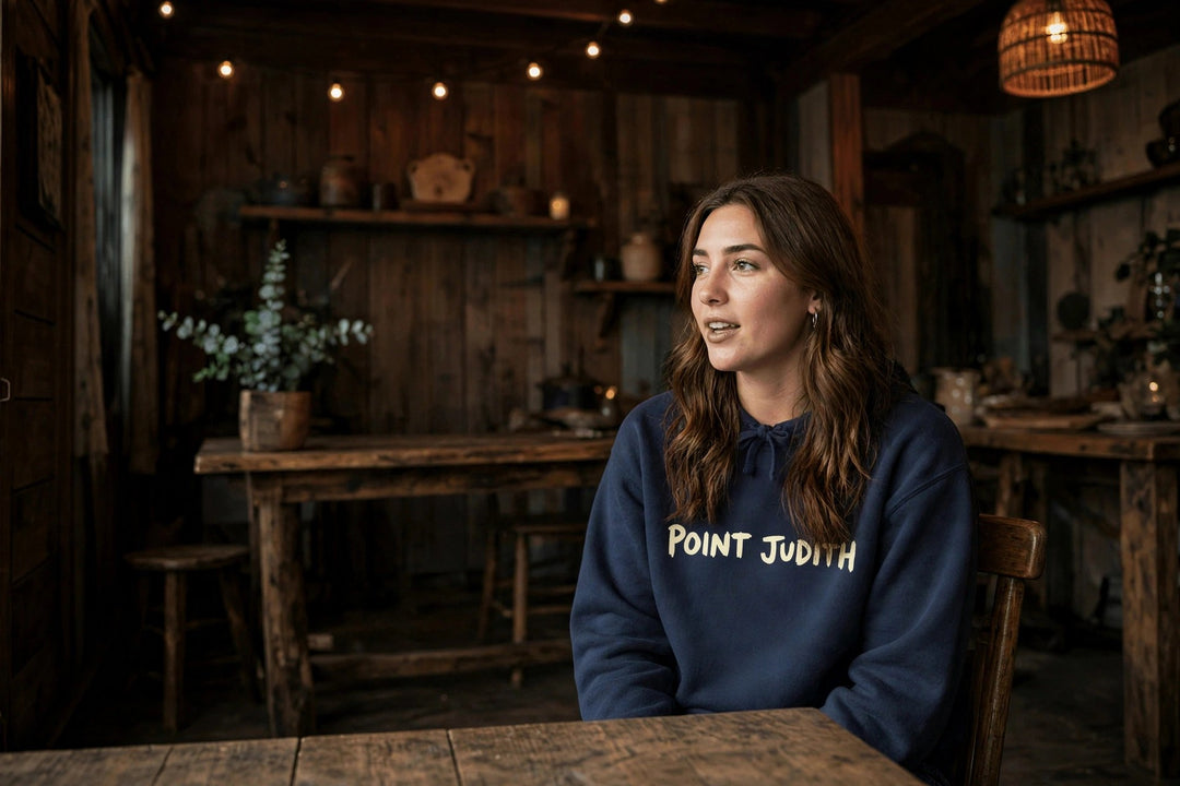 Point Judith Hoodie — in the Five Tides room, female front